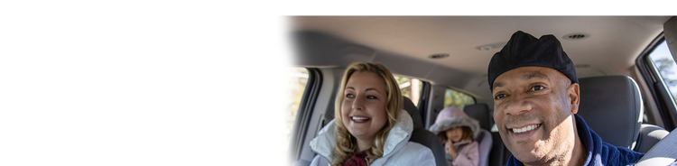 Actor portrayal of a happy family in a car